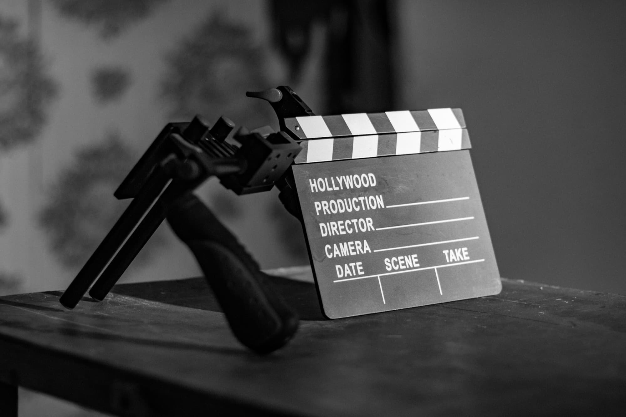 A film clapperboard standing on a table on set