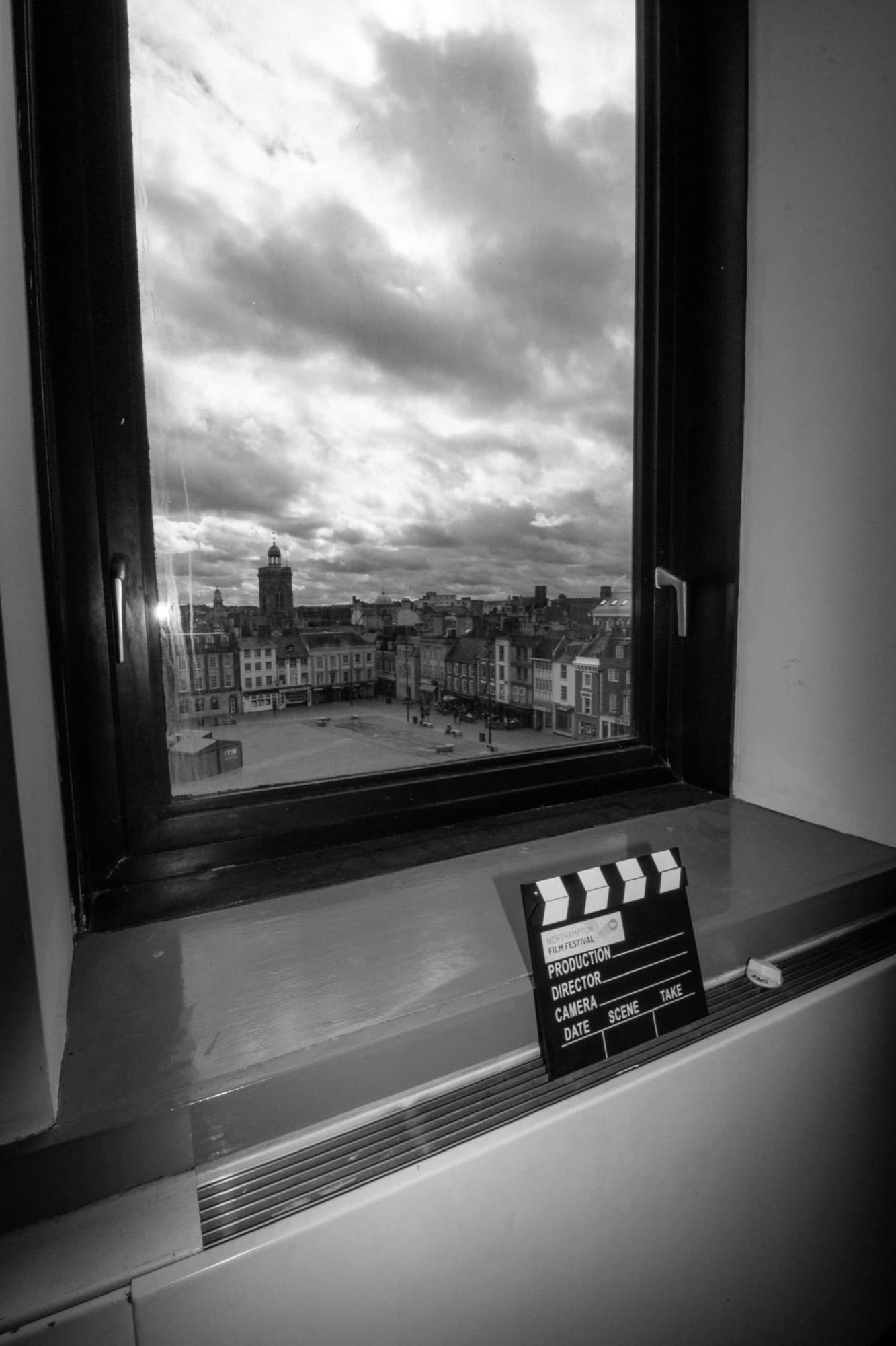 A clapperboard on the studio windowsill, looking out over Northampton town centre
